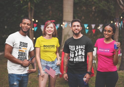 Group at bbq wearing merch